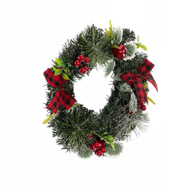 Christmas Wreath Decorated With Apples And Raspberries With Red Bows