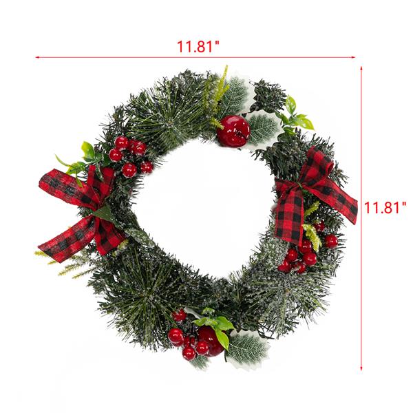 Christmas Wreath Decorated With Apples And Raspberries With Red Bows